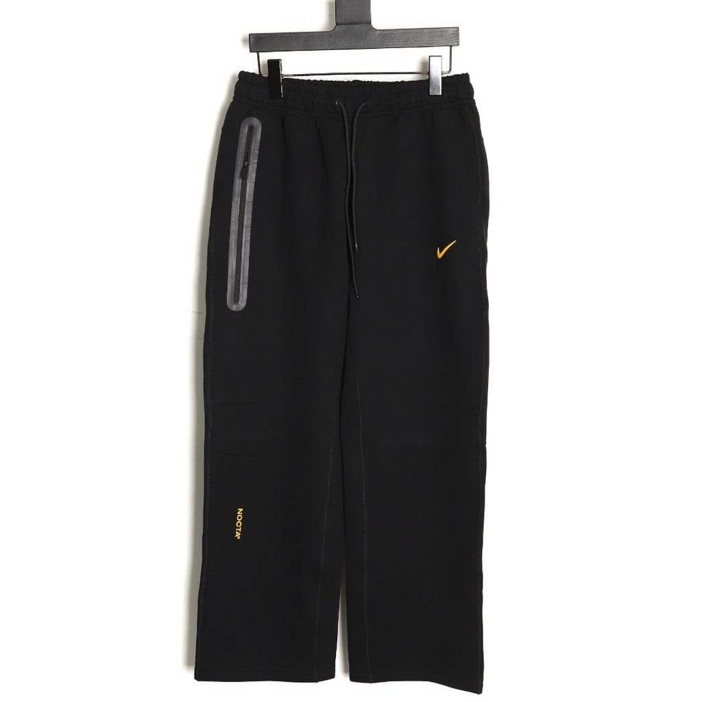Nike x NOCTA Tech Fleece Logo Pants – Black and Gold - front view