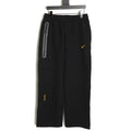 Nike x NOCTA Tech Fleece Logo Pants – Black and Gold - front view